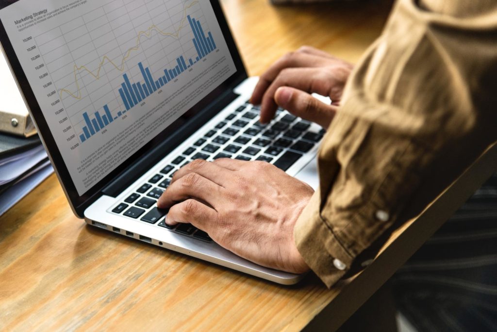 A man at a keyboard doing some SEO analysis for a WordPress Ecommerce website