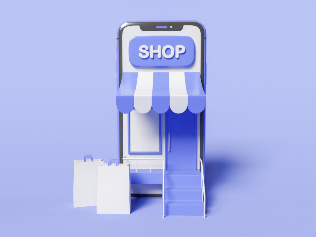 Image of phone screen converted into a shop front with shopping bags outside to illustrate How to Start an eCommerce Business blog post